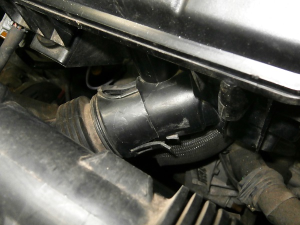Engage the air inlet duct onto the air filter box